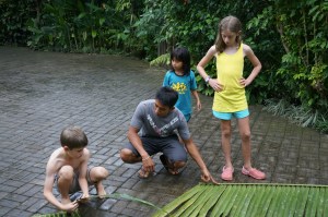 Dek helping Fletcher pick the perfect branch to weave. 
